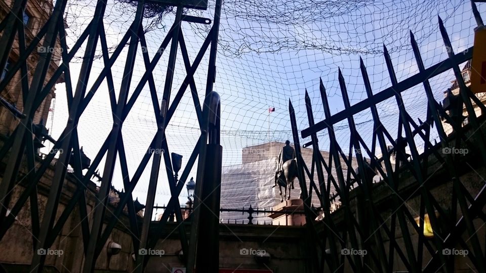 Exit 3 to Bank Underground Station in the City of London, during building works, with railed gate and overhead netting
