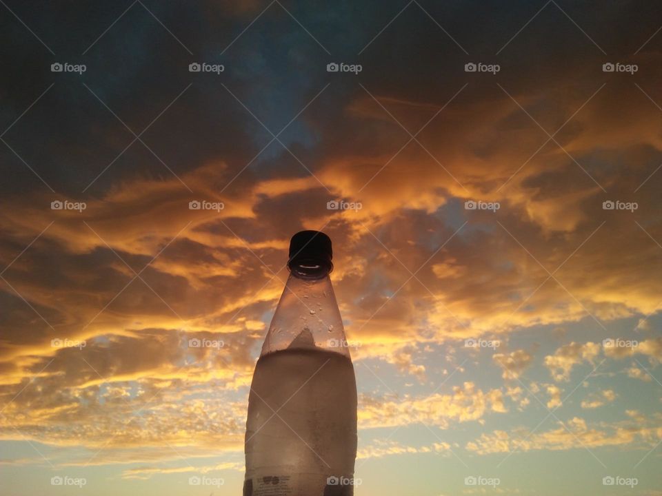 Scenic sky and a bottle embraces high sky.