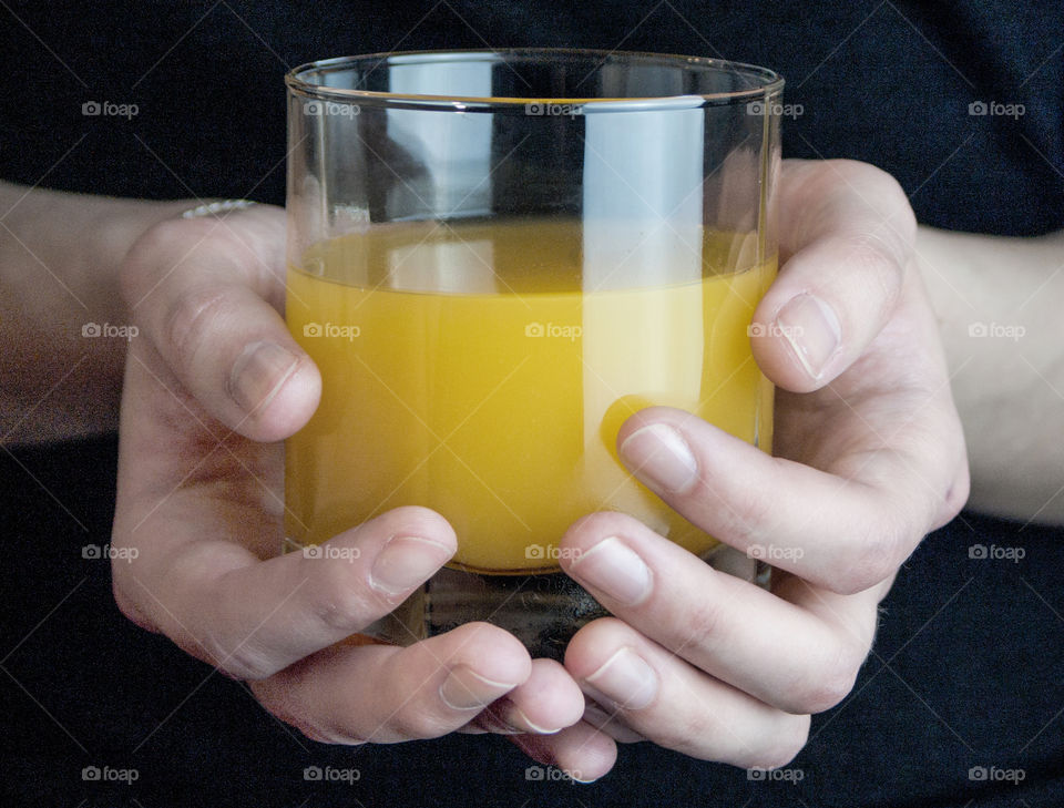 Juice and fruit in the hands of a girl