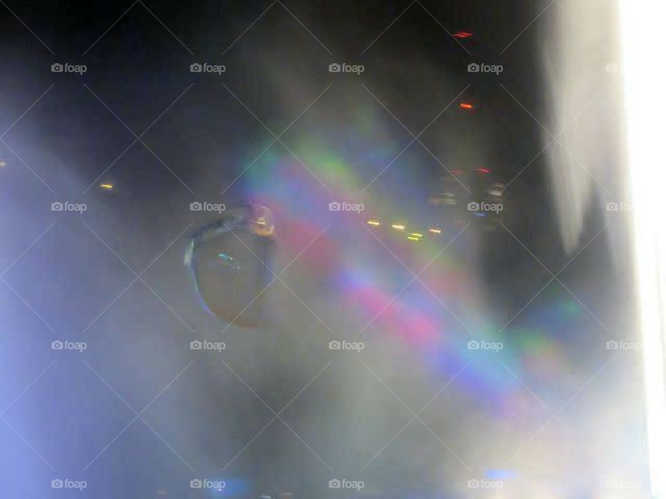 bubbles by the fountain in the mist with prism laser