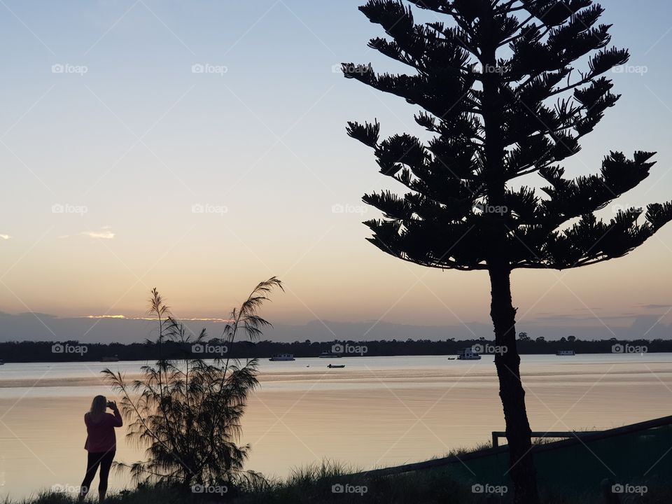 capturing photographer at dawn along the broadwater