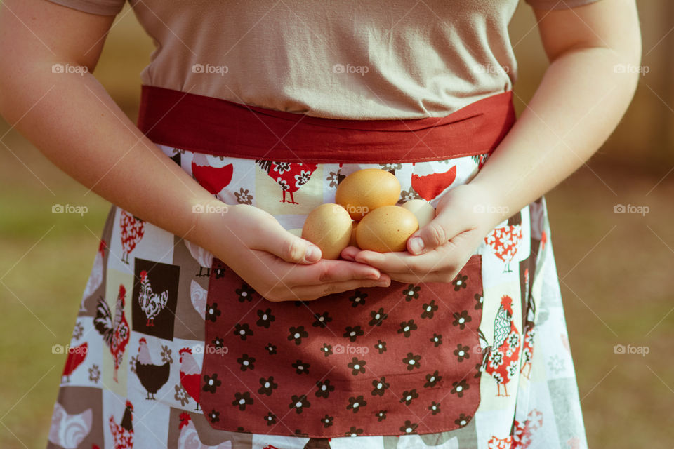 Close-up of woman holding eggs