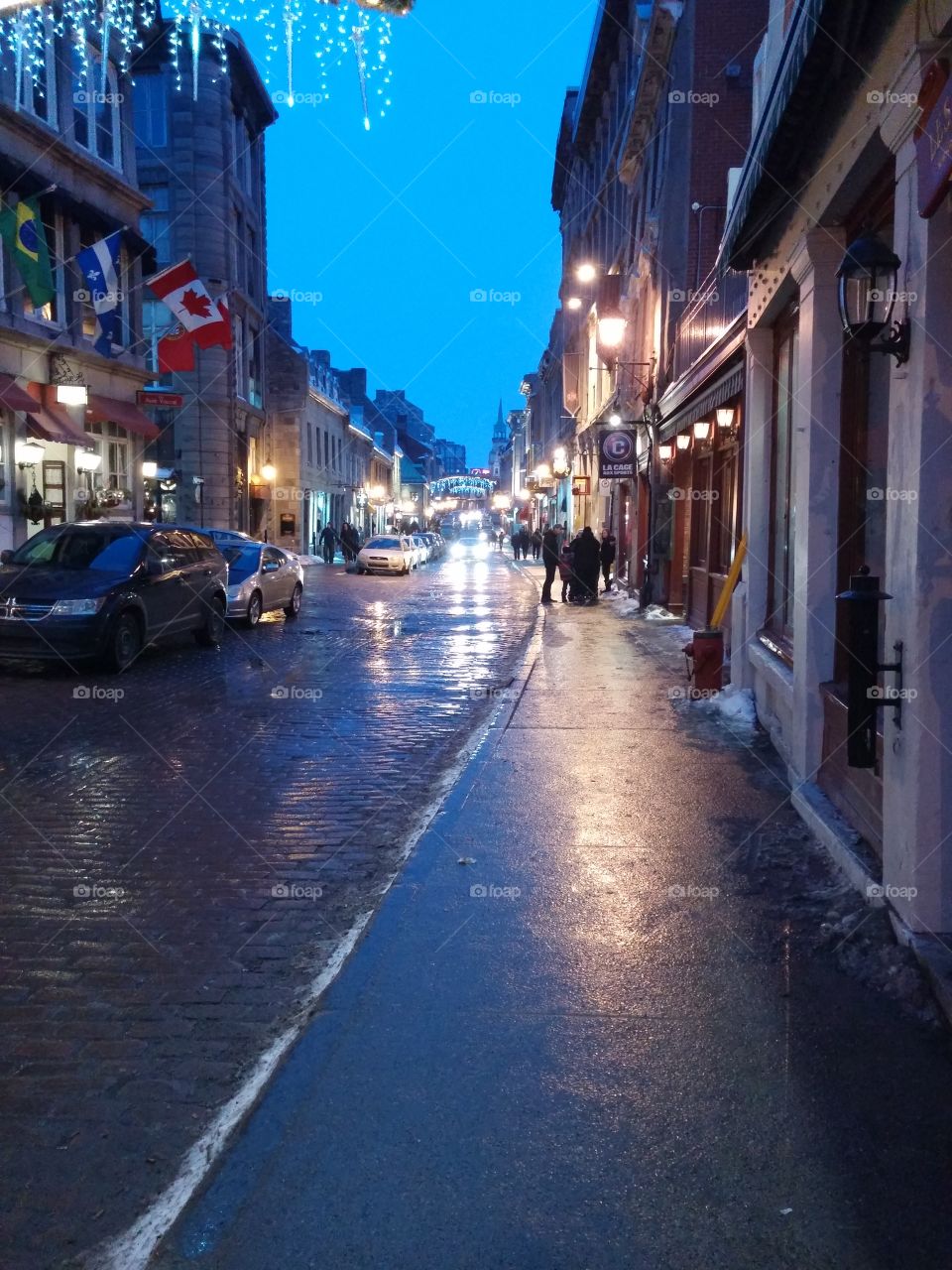 Old Montreal. Evening street in Montreal with city lights