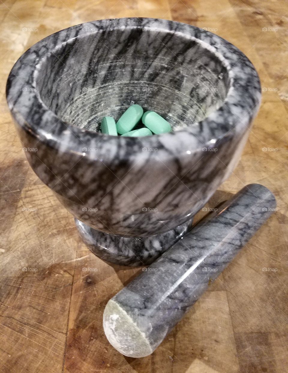 Mortar & Pestle for crushing pills, made of marble.