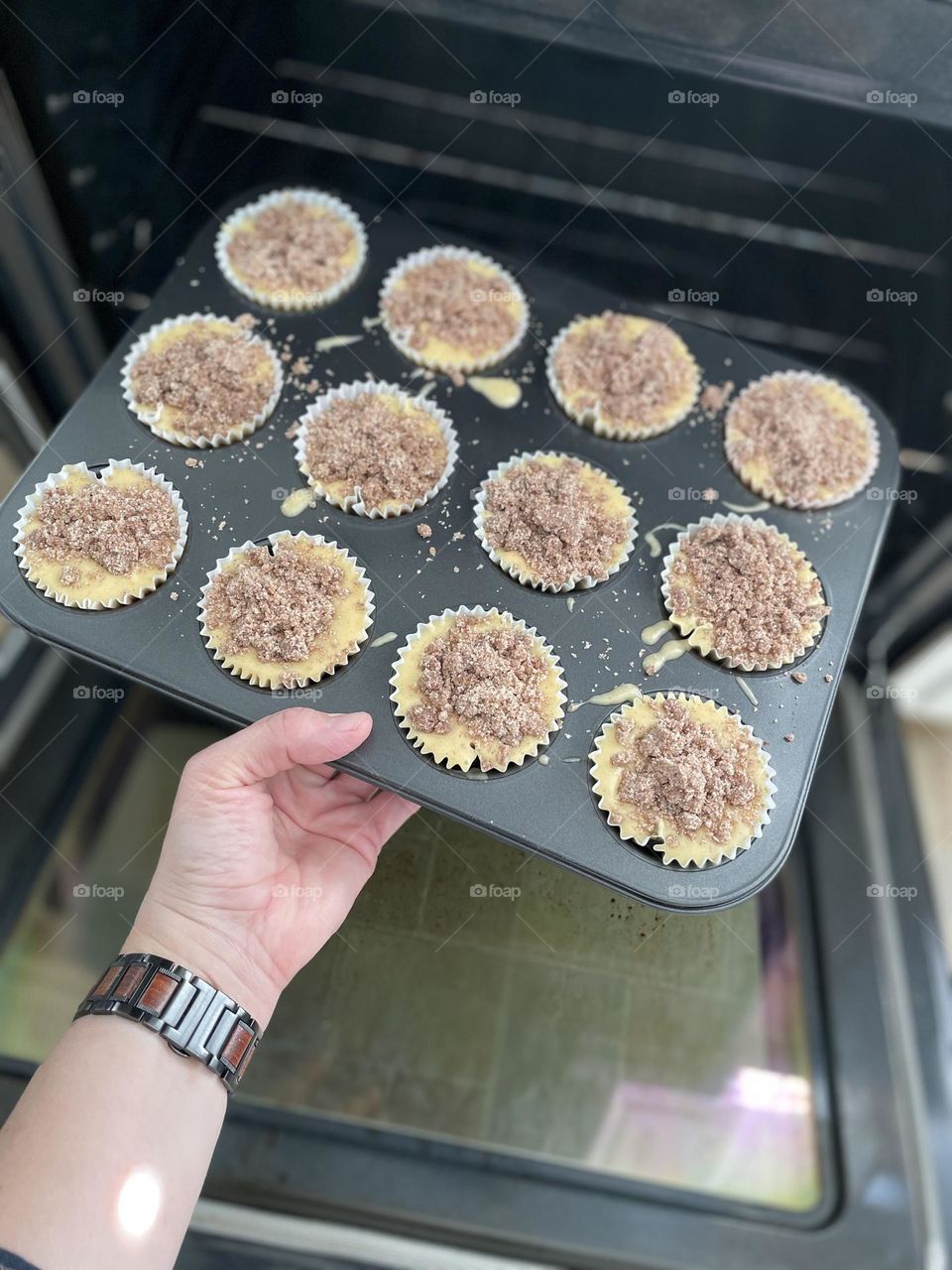 Mother making muffins for toddler, putting tray of muffins in the oven, baking in the kitchen, circles in the kitchen, muffins for the family, making memories in the kitchen, circles in everyday life
