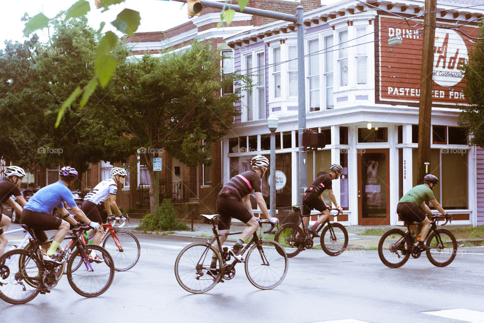 A group of cyclist ride through the downtown 