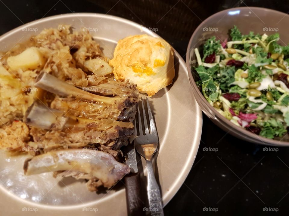 Pork ribs, Saurkraut & cheddar garlic biscuit with kale salad