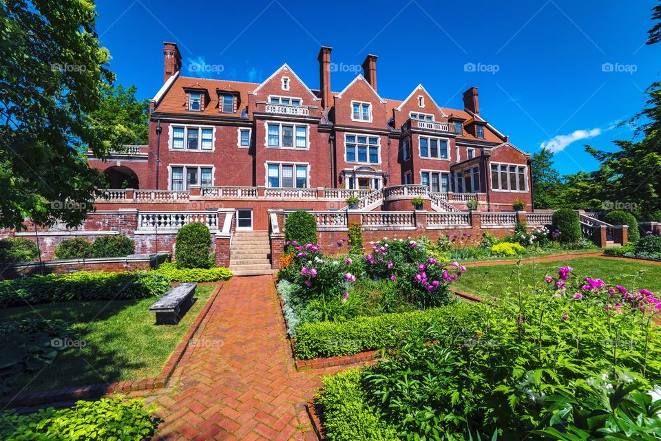 The stately Glensheen Mansion and stately summer flower display. Duluth, Minnesota.