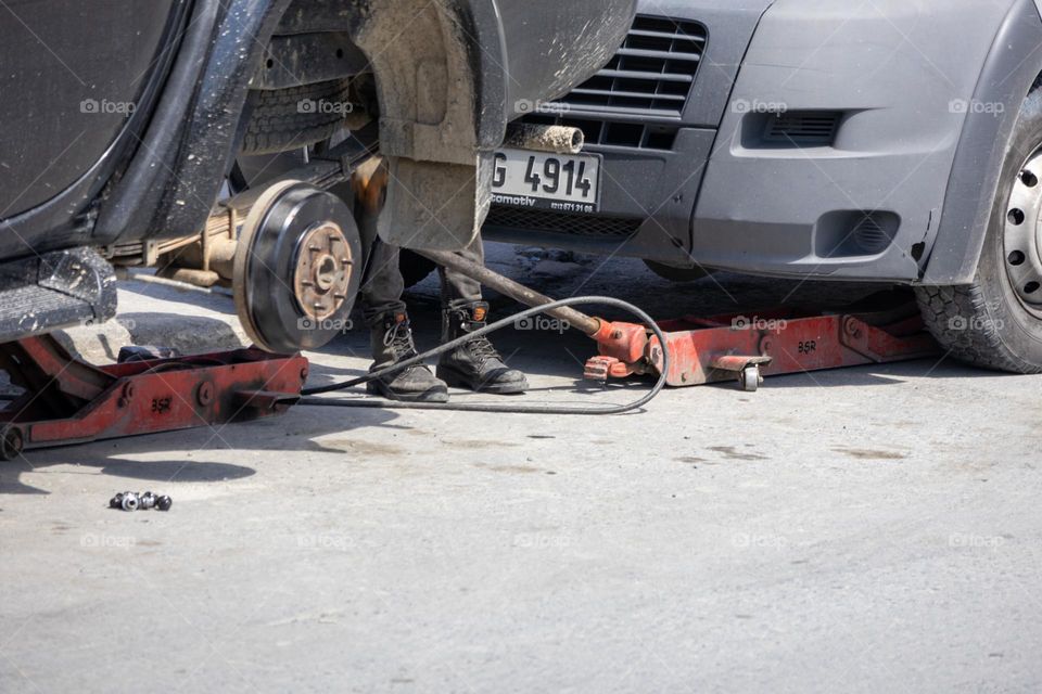 Tire mechanic's feet
