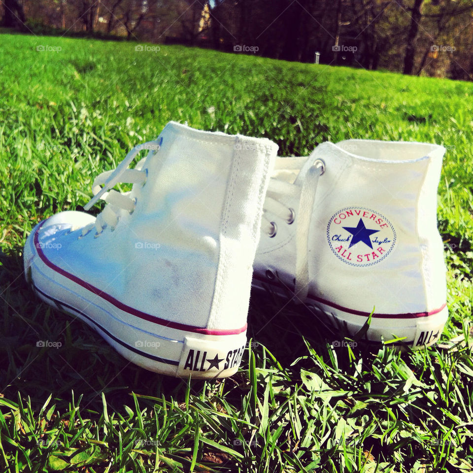 Converses in green grass