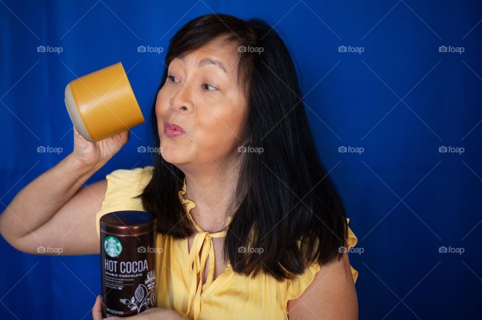 Woman drinking Starbucks hot cocoa 