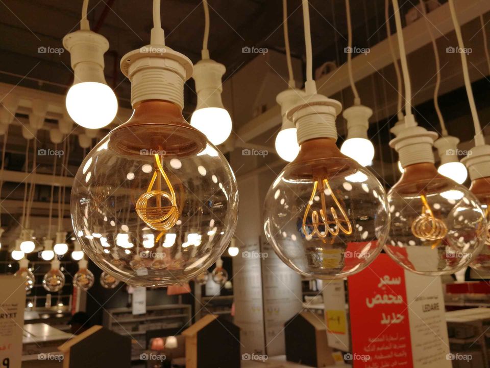 Hanging vintage light bulb, round sphere shaped light bulbs