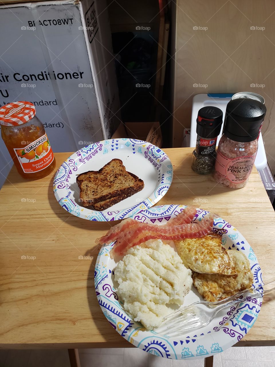 grits, eggs,  bacon,  toast with orange marmalade.