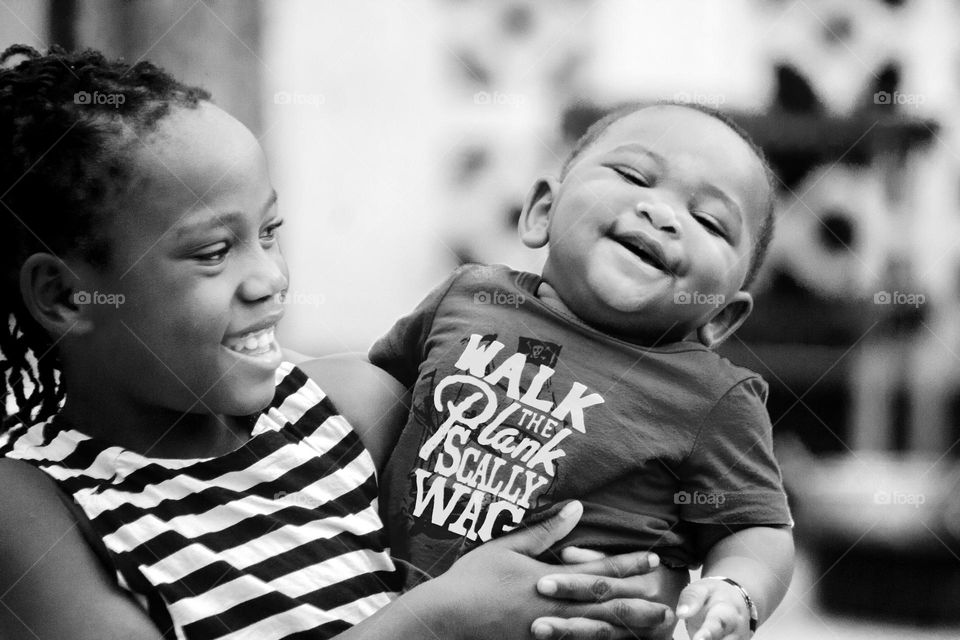 Happy family baby Smile Girl carrying a baby