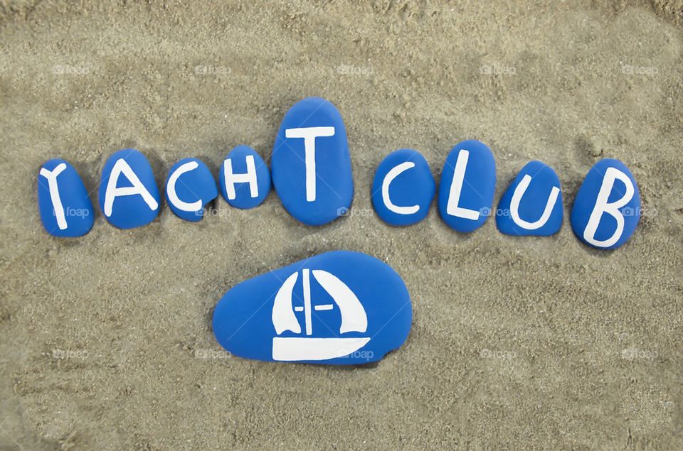 Yacht Club logo on colored stones