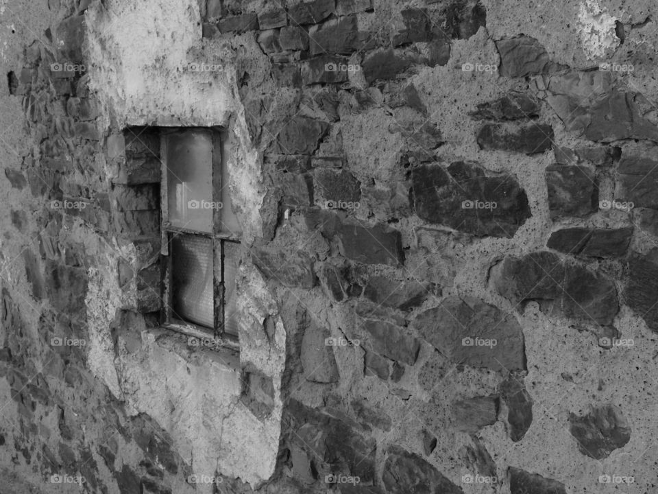 An old stone and concrete building in the town of Weiler in the district of Putscheid in Luxembourg that still has bullet holes in it from the Battle of the Bulge in World War II.