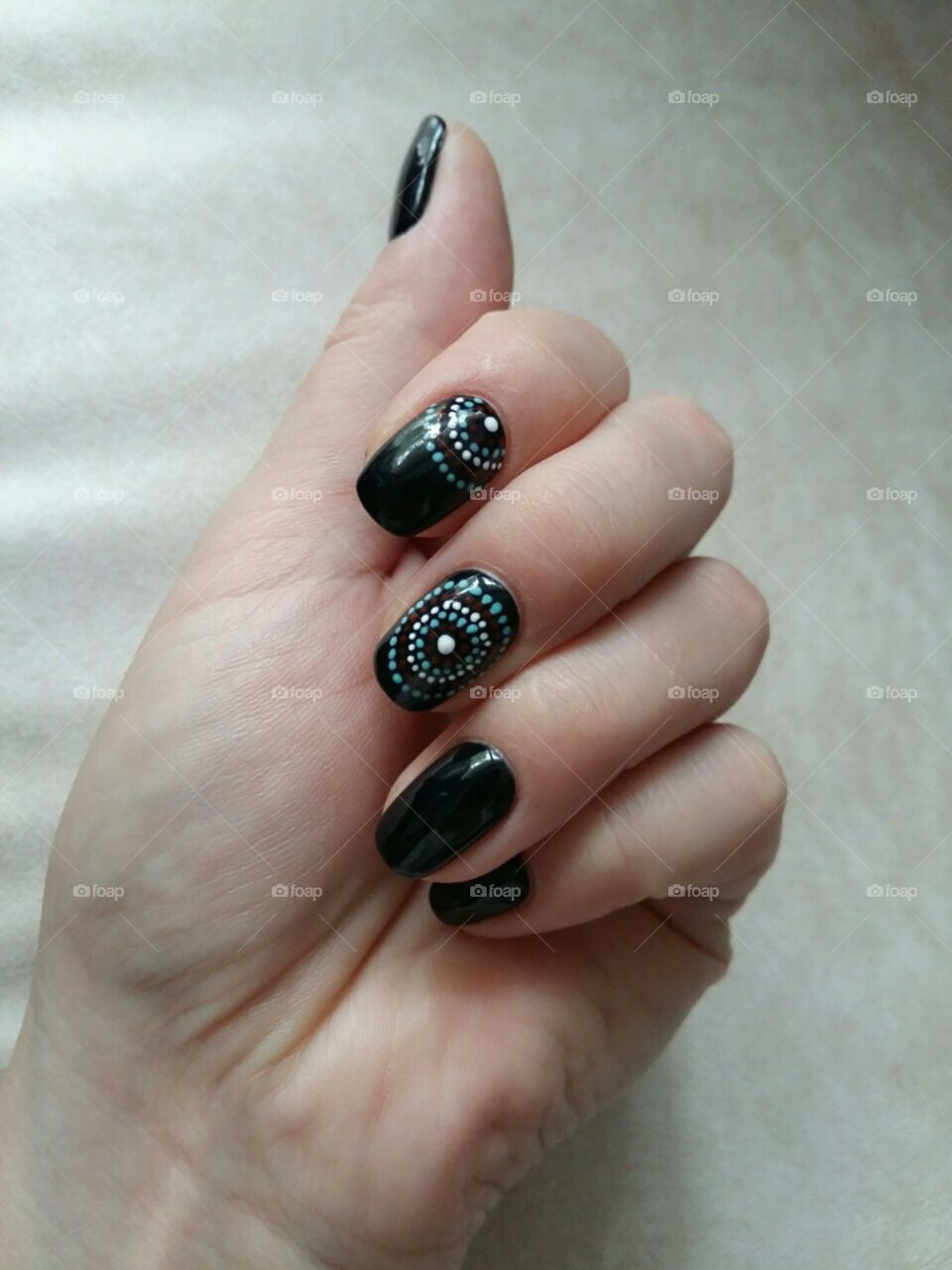 Black manicure with dots in circles