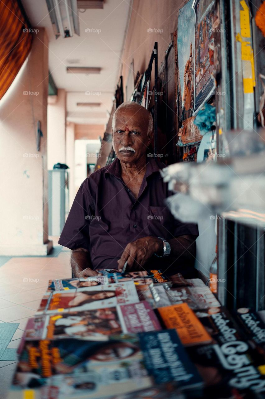 Indian old Man and shop books📚