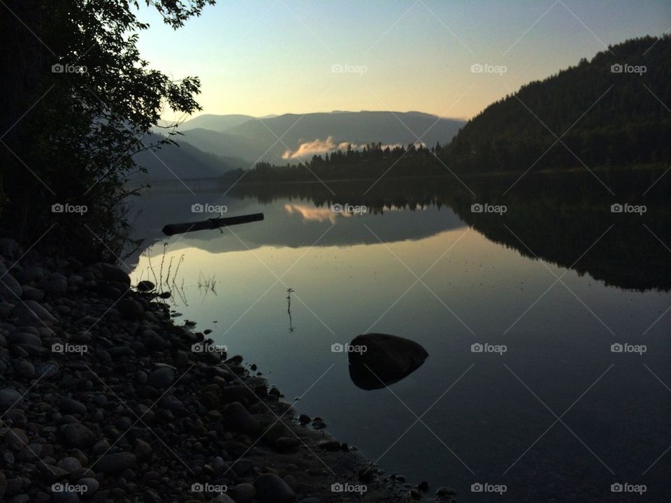 Sunrise over calm lake 
