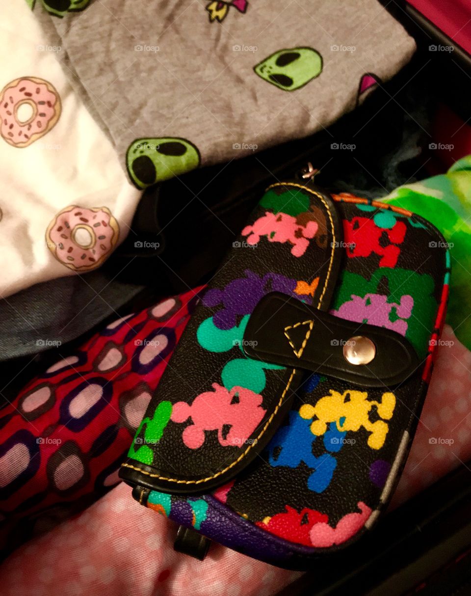 My suitcase: space alien t-shirt, donut t-shirt, scarves, and Mickey Mouse bag