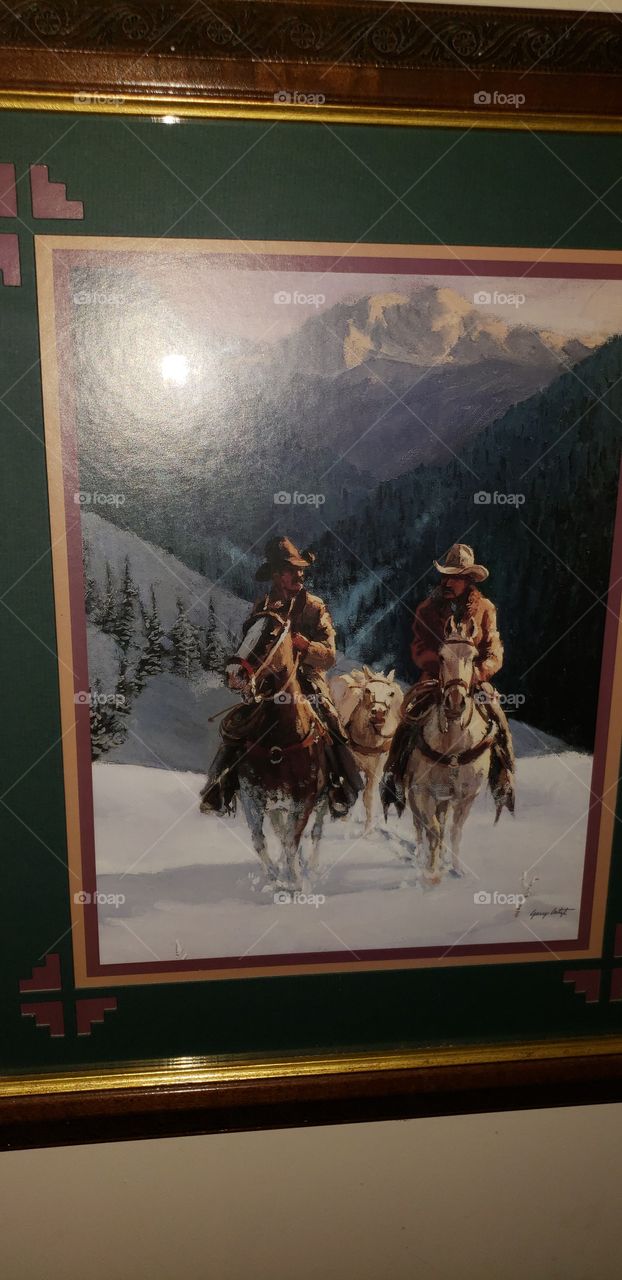 two men riding horses