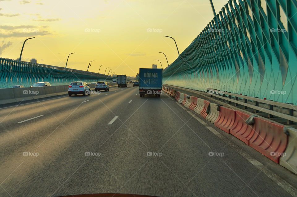 wide roadbed at sunset view from the car