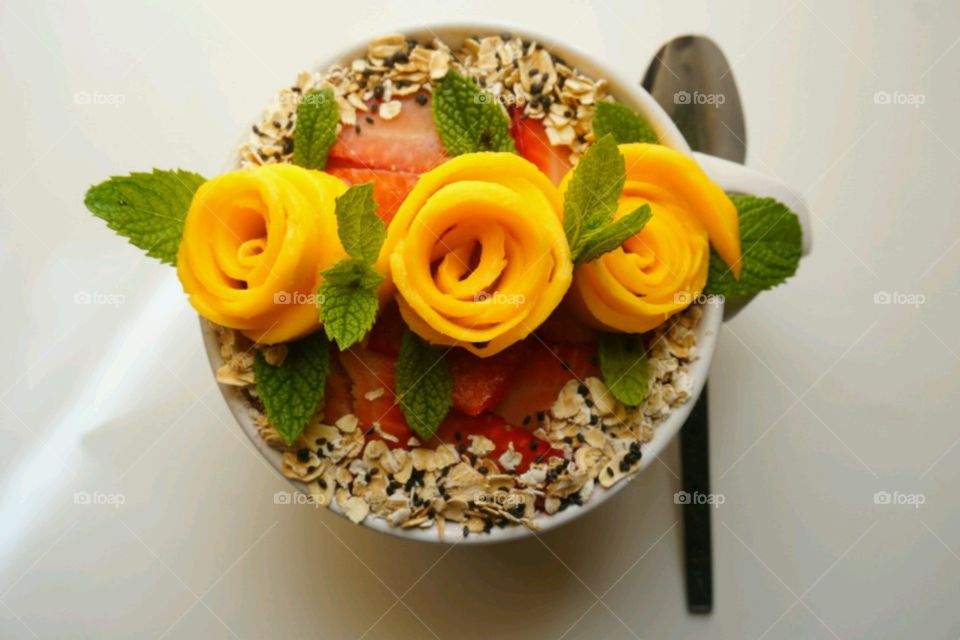 Fresh Fruit Smoothie - Mango flower smoothie Topped Mango,  strawberry,  cereal,  mints, raspberry and blueberry