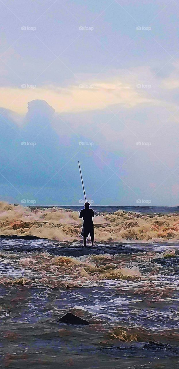 Roaring fierce waves of ocean with thunder sound grazing towards you like a lion and you standing tall enough like Eiffel to just enjoy your time in a rocking weather while summer is heating your blood and ocean splash it away like a pro = Cool