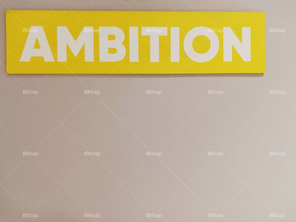 Written: "ambition" on a yellow background