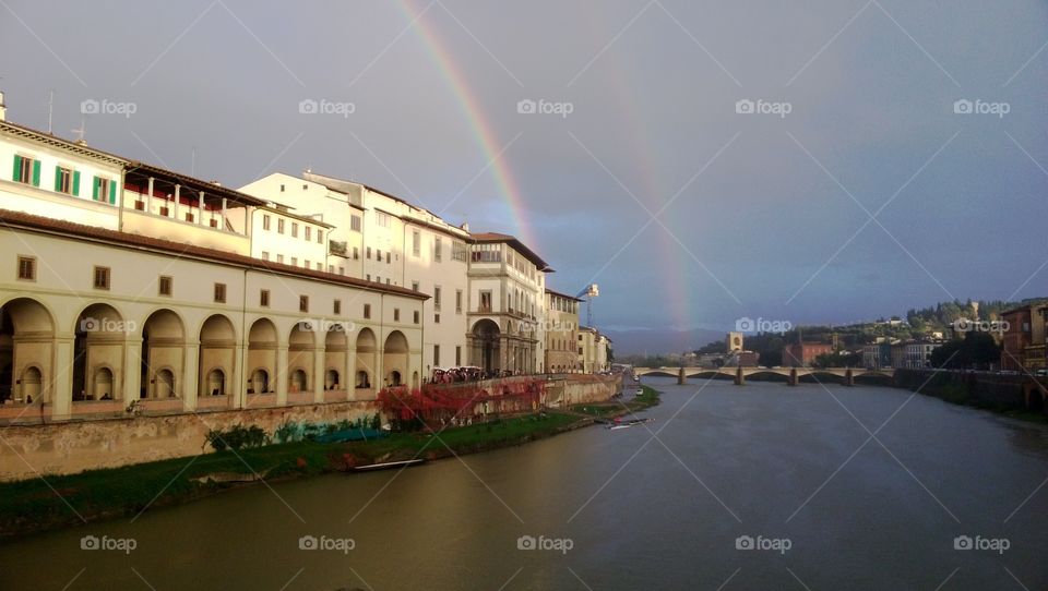 The double rainbow in Florence. The double rainbow above Arno in Florence