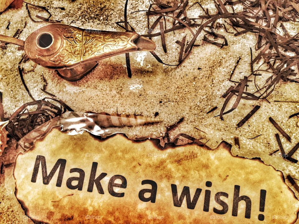 Make a wish. A sign next to a lamp