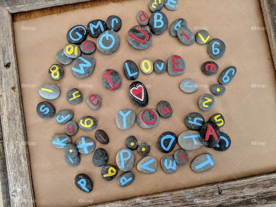 I love you spelled out on letter stones in a frame