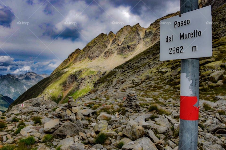 hiking trail signpost on the swiss/italian border.