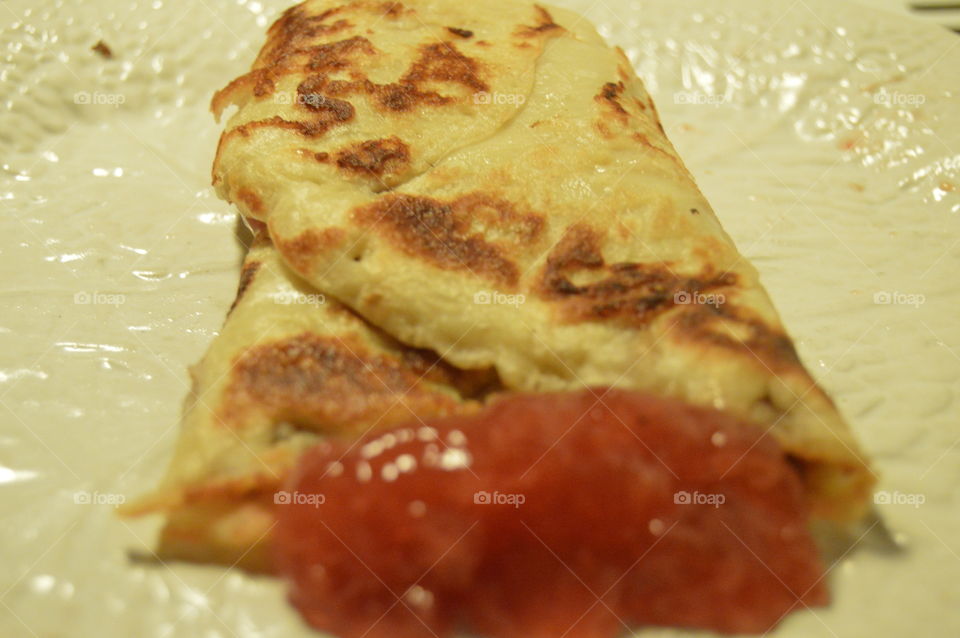 Thin pancake resembling crepe