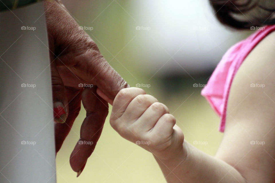 Grandma and granddaughter holding hands