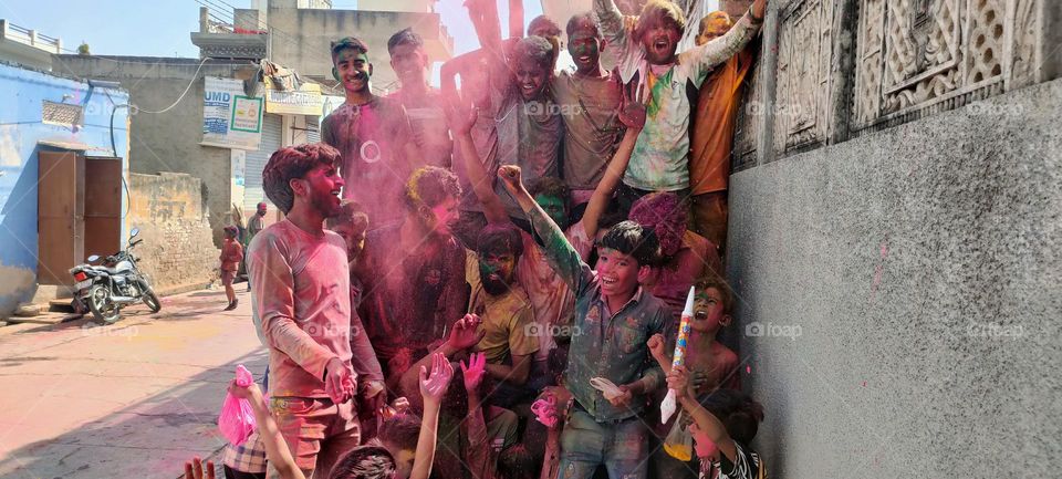 celebrate holi festival with colony children