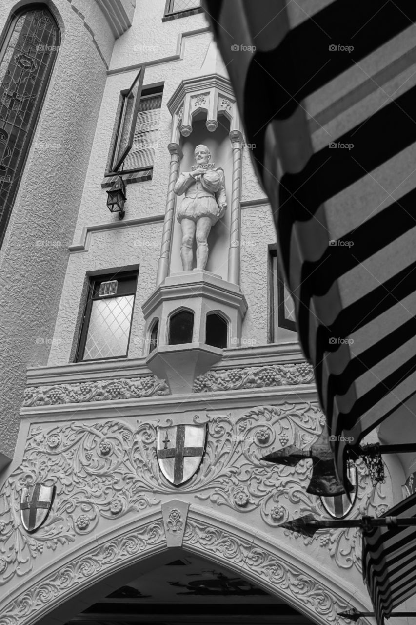 The south end of London Court in Perth, Western Australia. The statue of Sir Walter Raleigh can be seen as the part of interior. Whole design looks like Tudor era in London.