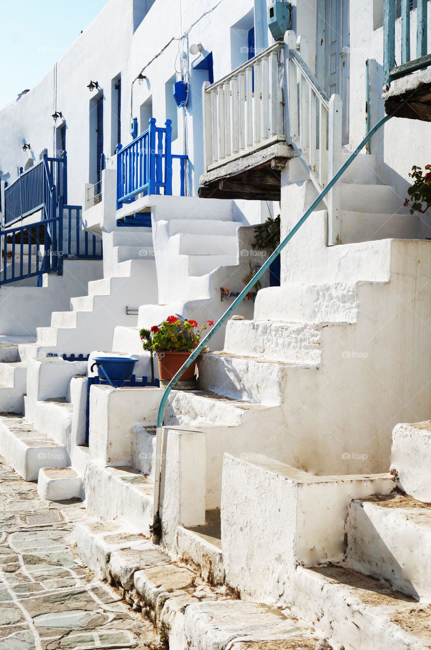 white and blue street in greece