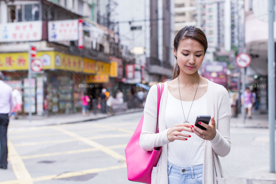 Asian woman using a smart phone