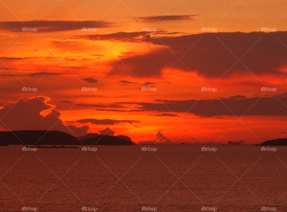 Scenic view of sea against dramatic sky