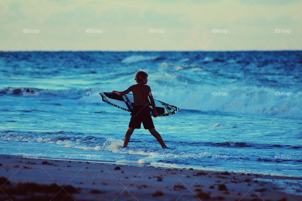Beach lover surfer in summer 