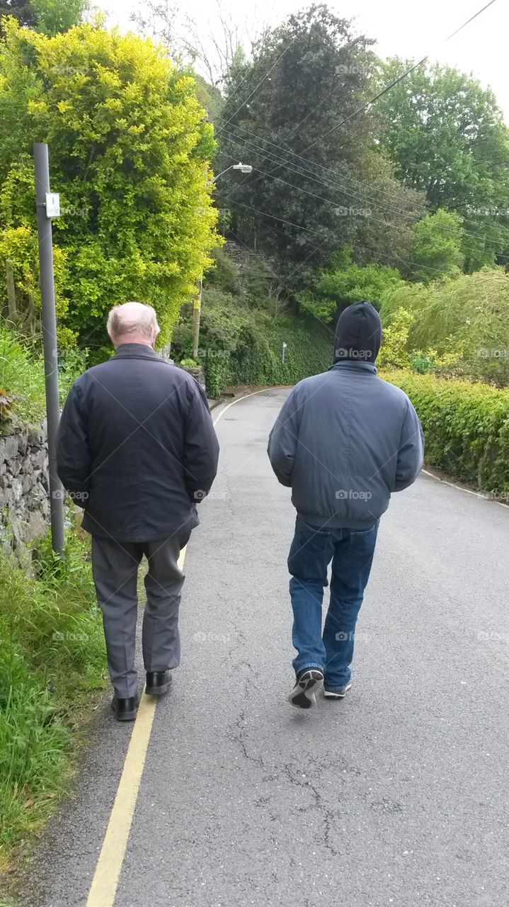 Grandfather and Grandson taking a morning stroll