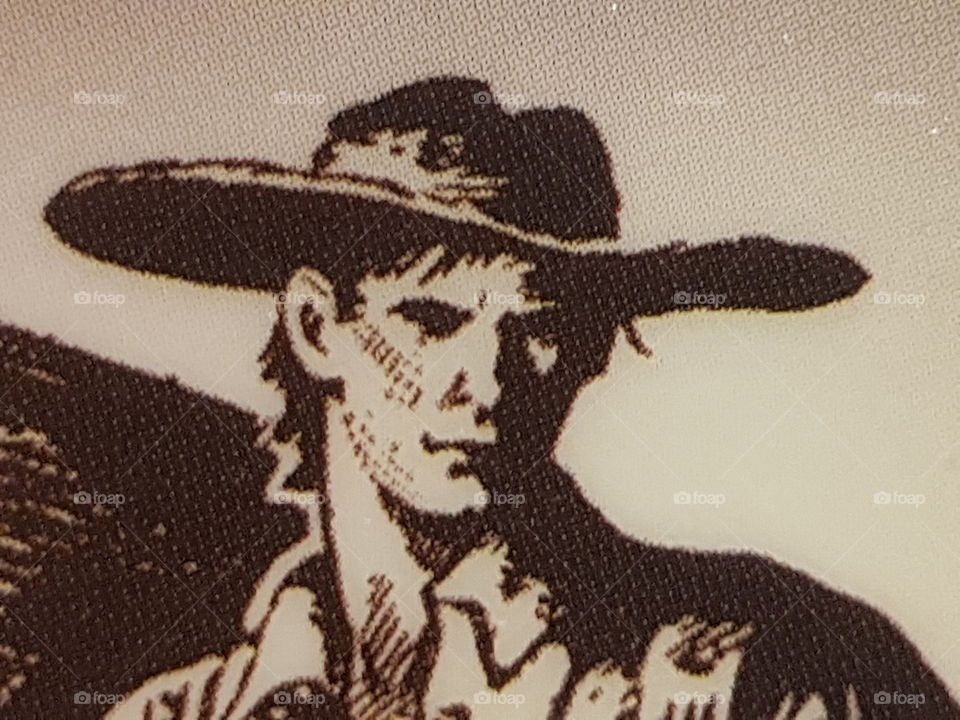a section of a cover of a book from dianella library. A cowboy.