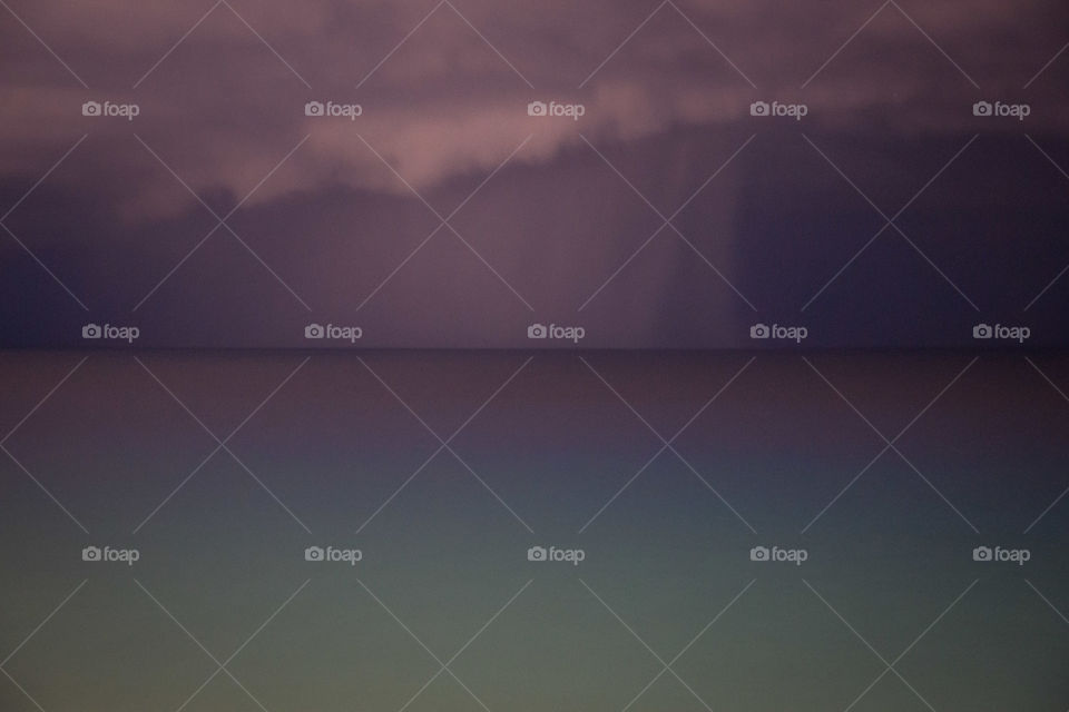 Scenic view of storm cloud at sunset