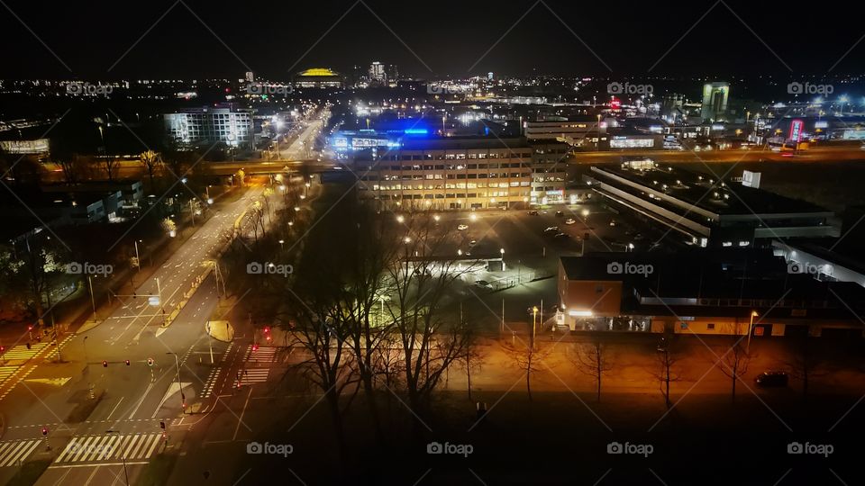 Cityscape from an elevated vantage point of Amsterdam, The Netherlands, by night.