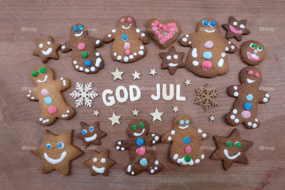 God Jul, Merry Christmas message with wooden letters and homemade gingerbread cookies