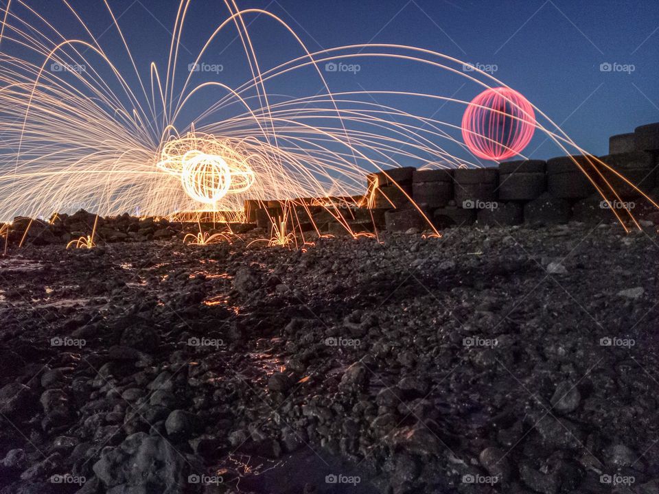 when steelwool and light painting are photographed using the long exposure technique