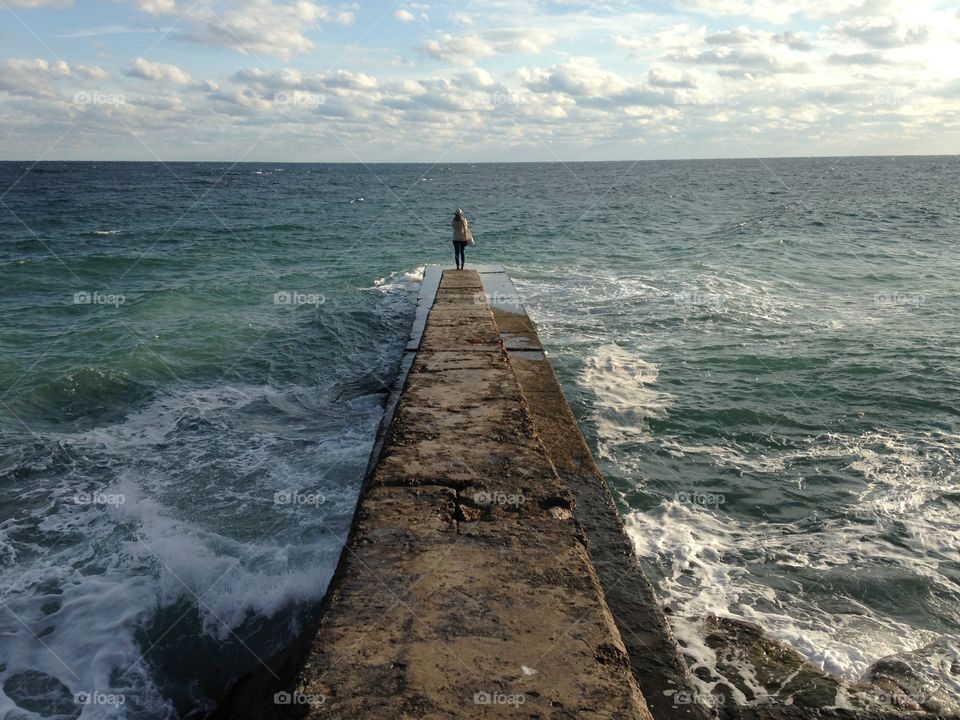 Girl alone at the beach