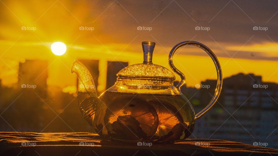 the reflection of the sun in the teapot