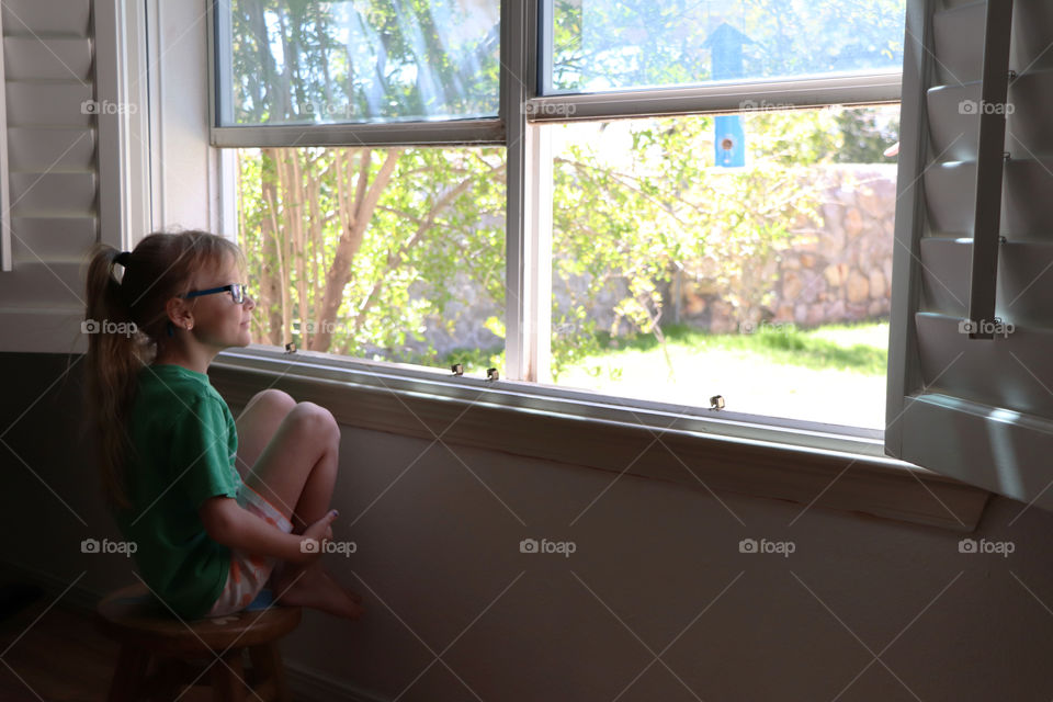 Girl watching out the window